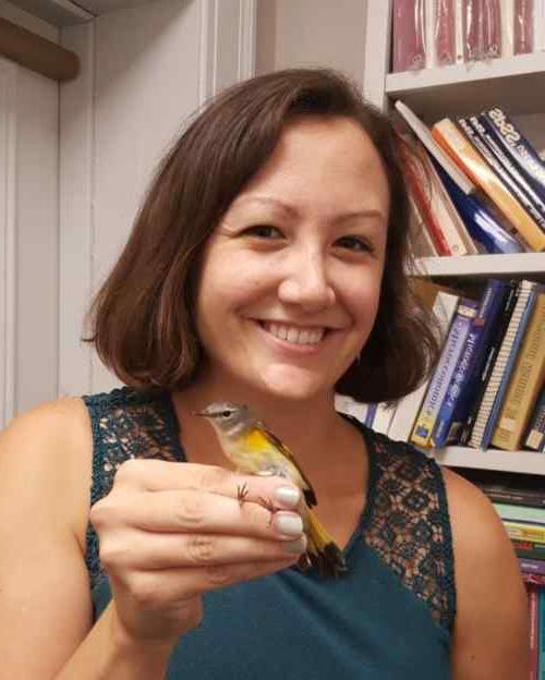 Jennie Rinehimer holding a songbird